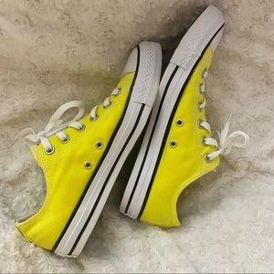 Bright yellow low top converse
